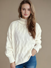 Ivory oversized cable knit turtleneck sweater with a relaxed fit.