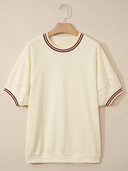 Cream cotton tunic top with striped neckline and sleeve cuffs