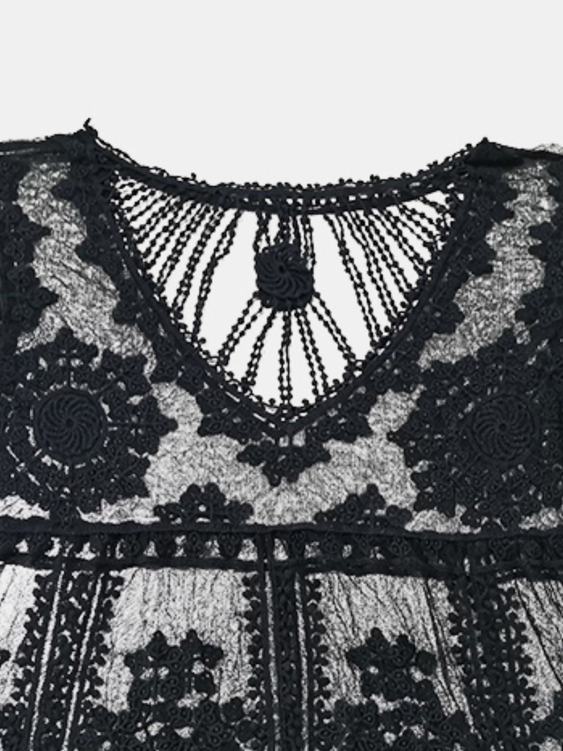 Black embroidered crochet kaftan cover-up with intricate floral details and a V-neckline.