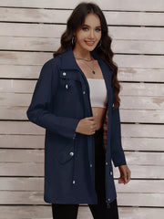 Navy blue drawstring trench coat with snap-down details and plaid lining.