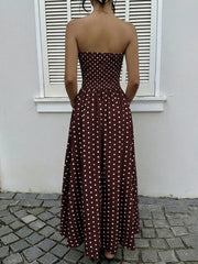 Brown polka dot maxi dress with smocked bodice and A-line skirt.