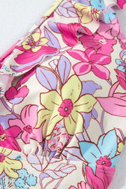Floral ruffle one-piece swimsuit in fuchsia pink with a vibrant floral print.