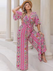 Bohemian tie-front palazzo jumpsuit in Deep Rose with bell sleeves and vibrant paisley print.