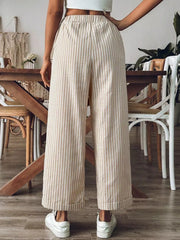 Chic high-waisted beige and white striped wide-leg pants with cuffed hems.