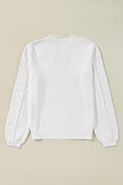 White knit sweater with textured leaf pattern on sleeves and scalloped notch neck.