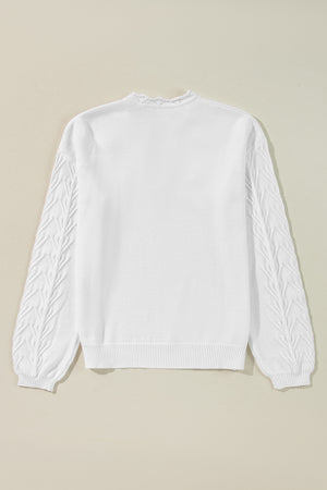 White knit sweater with textured leaf pattern on sleeves and scalloped notch neck.
