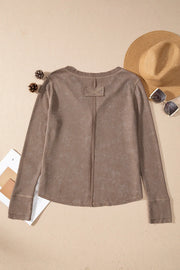 Taupe waffle knit long sleeve blouse with a notch neckline and button detail.