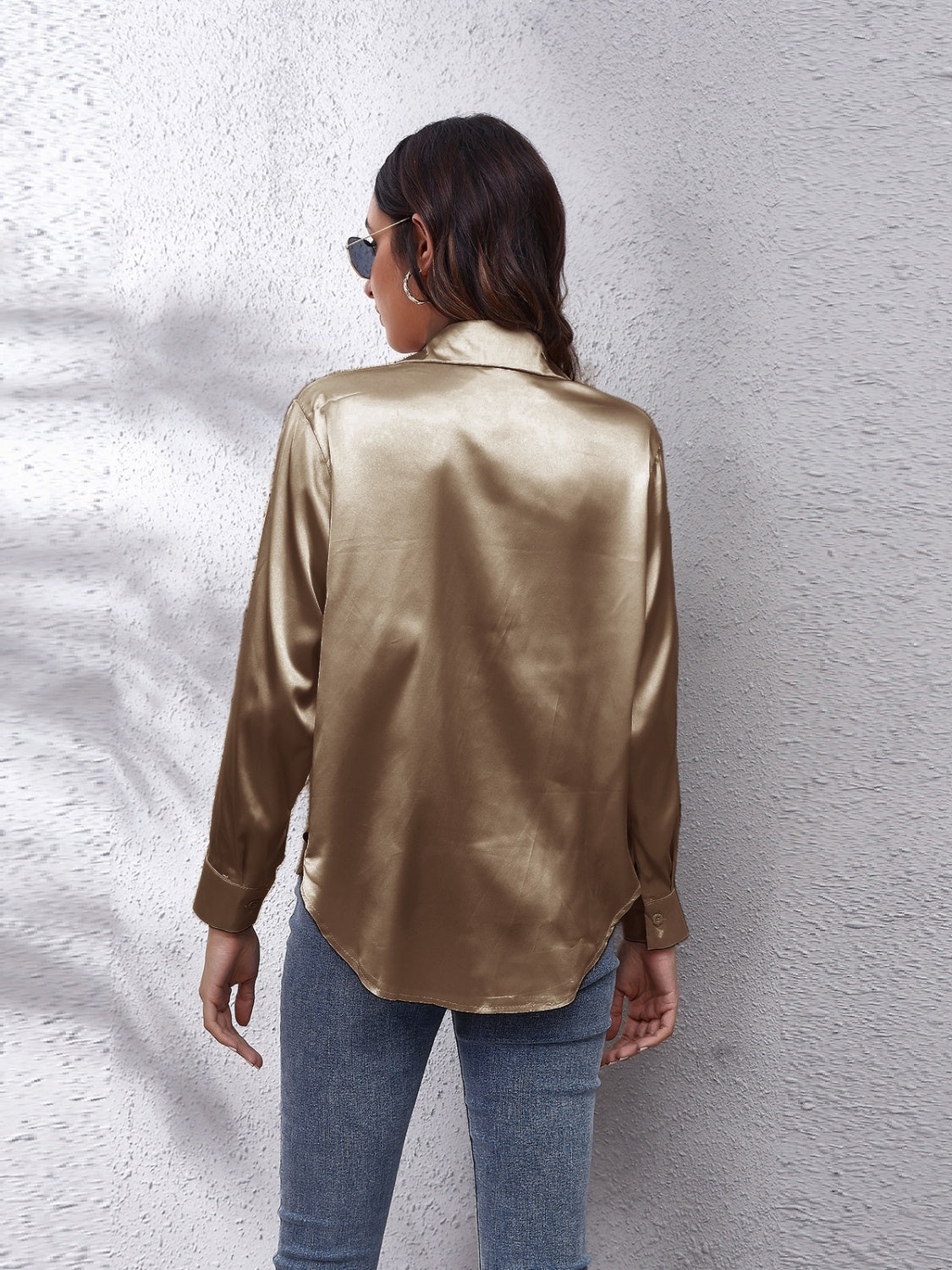 Gold silk button-down shirt with long sleeves and a relaxed fit.