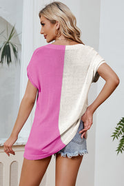 Split-tone knit tee with dolman sleeves in pink and tan, featuring a relaxed fit.