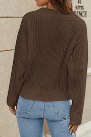 Brown knit pullover sweater with a V-neck and textured detail, shown from the back.