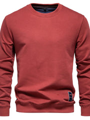 Deep Red crewneck sweatshirt with subtle patch detail on hem
