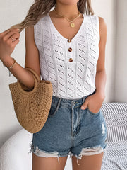 White openwork knit tank top with V-neck and button detail, styled with denim shorts.