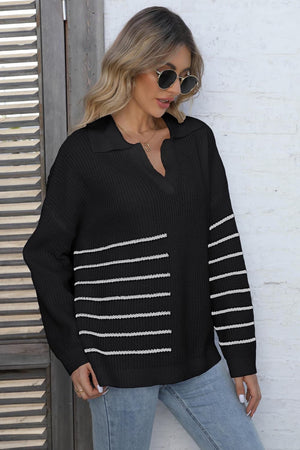 Black collared knit sweater with white stripe block detail and v-neck.