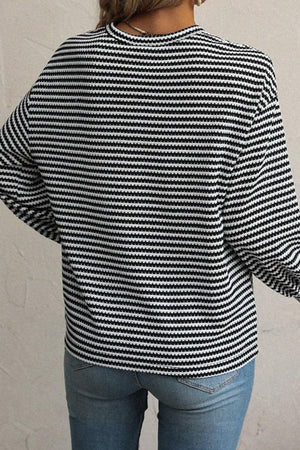 Textured stripe balloon sleeve top in black and white, casual long sleeve blouse.