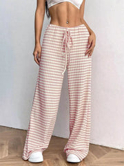 Pink and white striped ribbed wide-leg pants with drawstring waist.