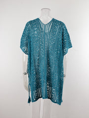Teal open-knit V-neck beach cover-up with short sleeves and tassel tie detail.