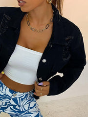 Black cropped distressed denim jacket with a collared neckline and silver buttons.