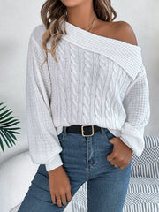 White off-shoulder cable knit pullover sweater with asymmetrical neckline and balloon sleeves.