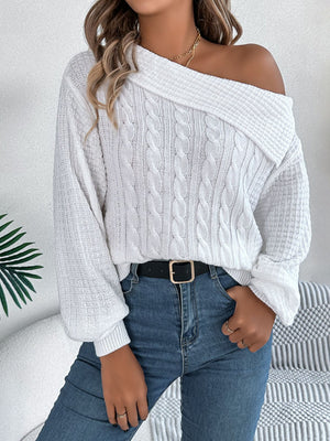 White off-shoulder cable knit pullover sweater with asymmetrical neckline and balloon sleeves.