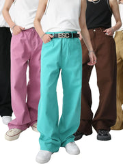 Wide-leg high-rise denim trousers in teal, pink, brown, and black, styled casually.