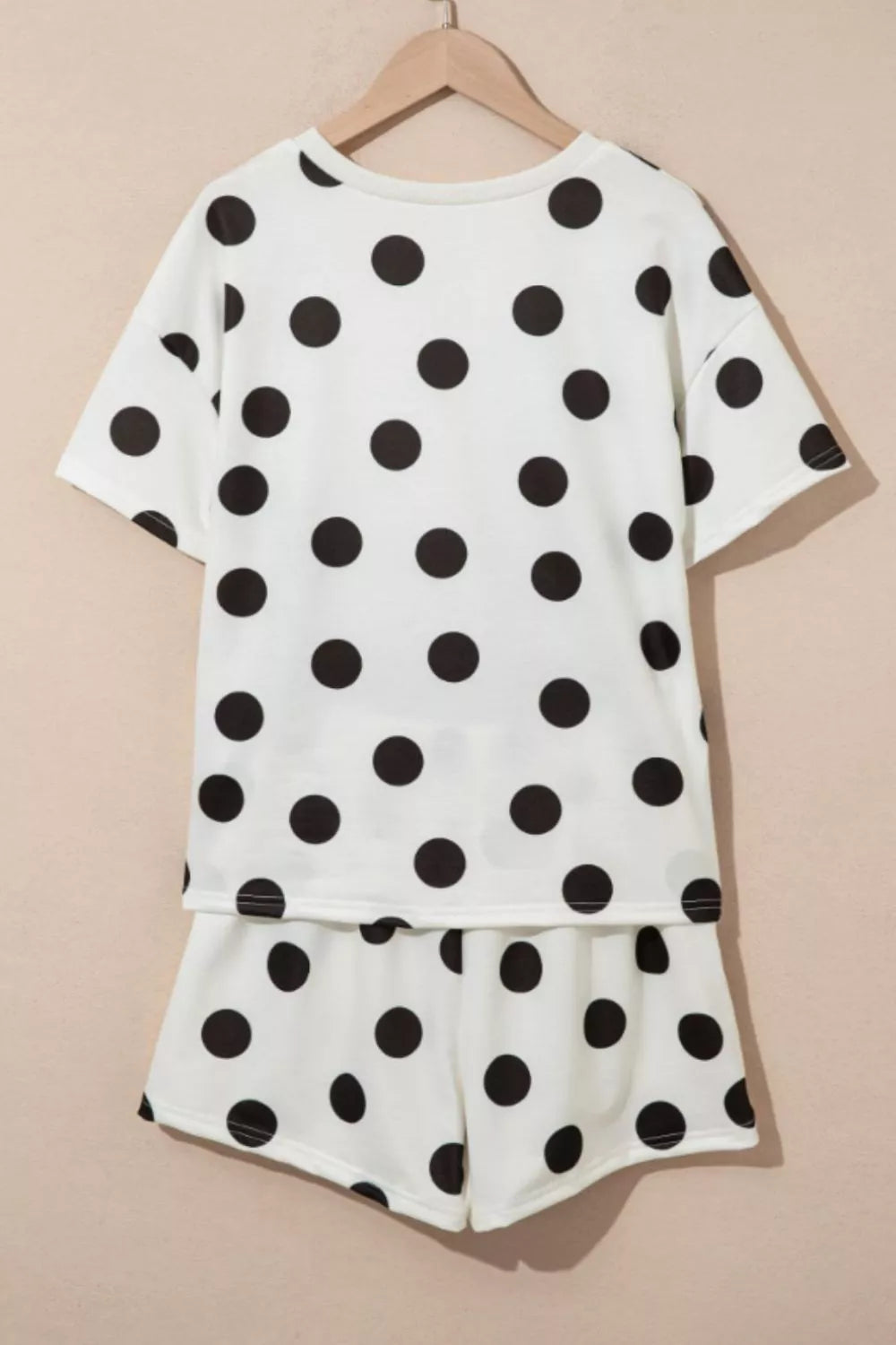White polka dot loungewear set with crew neck top and shorts.
