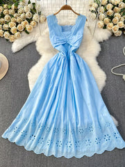 Blue eyelet maxi dress with cutout detail and smocked bodice