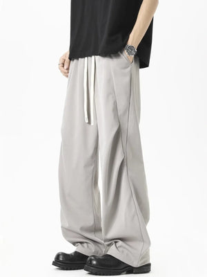 Grey loose fit drawstring pants with a comfortable fit and casual style.