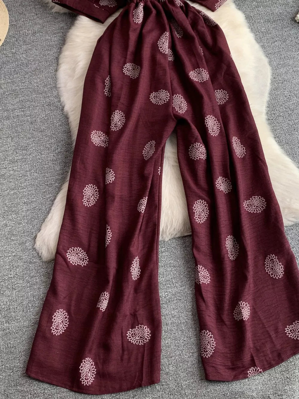 Burgundy paisley print drawstring jumpsuit with wide legs