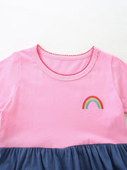 Pink toddler dress with rainbow embroidery and ruffled hem