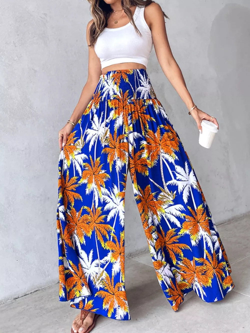 Bohemian print wide leg pants in royal blue with smocked waist and palm tree pattern