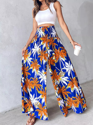 Bohemian print wide leg pants in royal blue with smocked waist and palm tree pattern