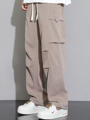 Men's relaxed fit cargo sweatpants in Dust Storm with drawstring waist and multiple flap pockets.