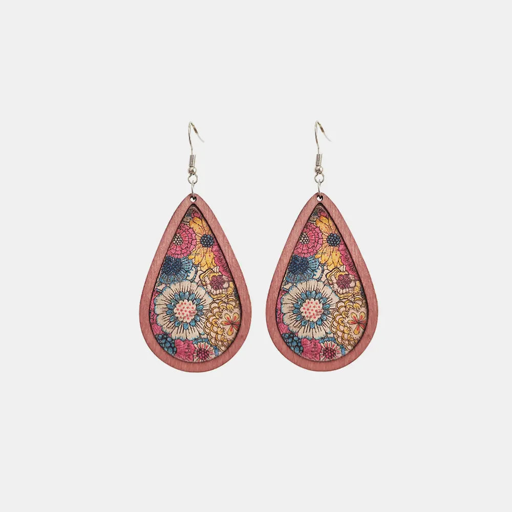 Teardrop woodgrain earrings with a colorful floral pattern in pink, blue, and yellow.