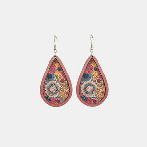 Teardrop woodgrain earrings with a colorful floral pattern in pink, blue, and yellow.