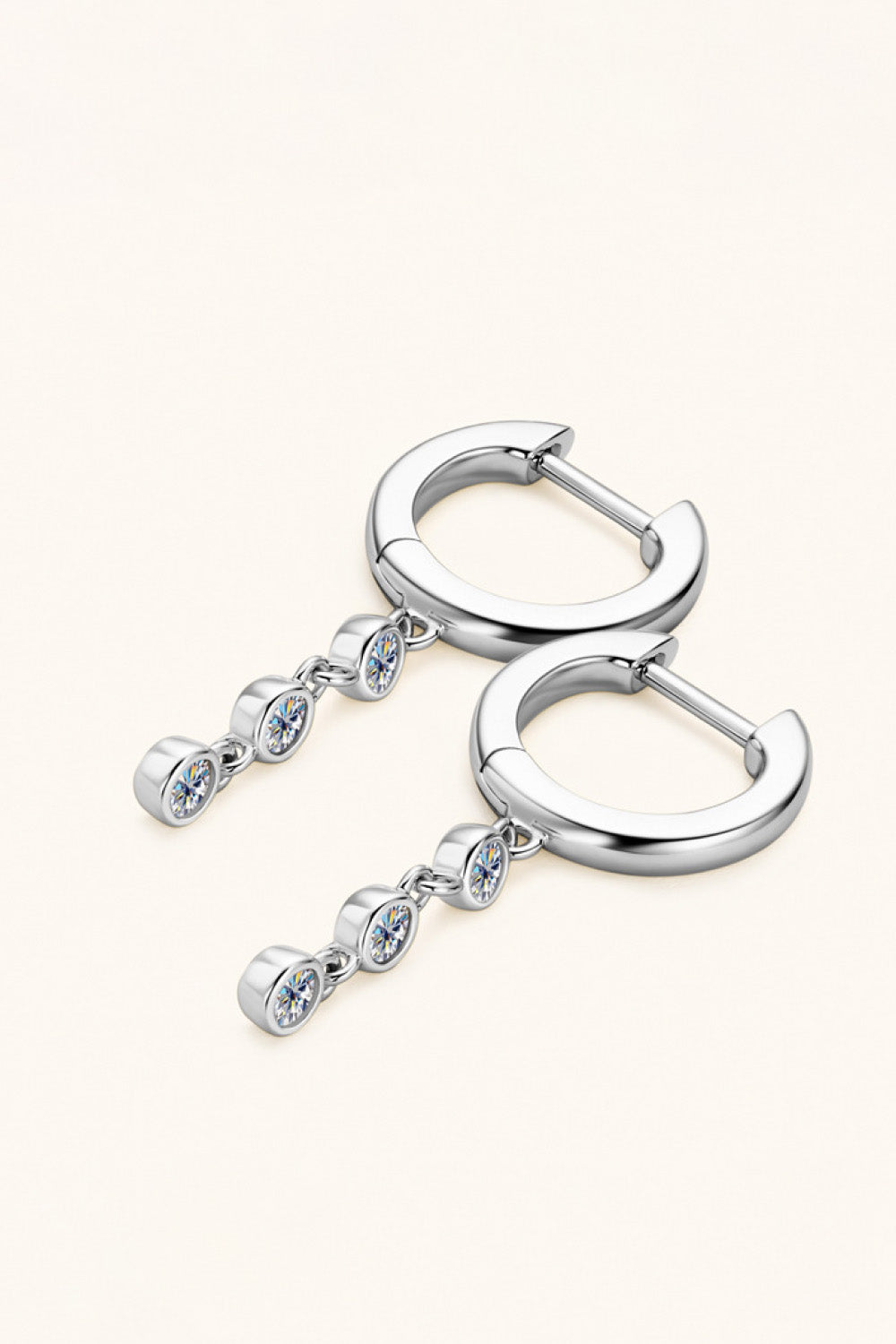Silver hoop earrings with dangling gemstone accents