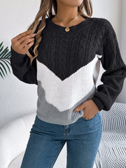 Chevron cable knit sweater in black, white, and grey with a crew neck.