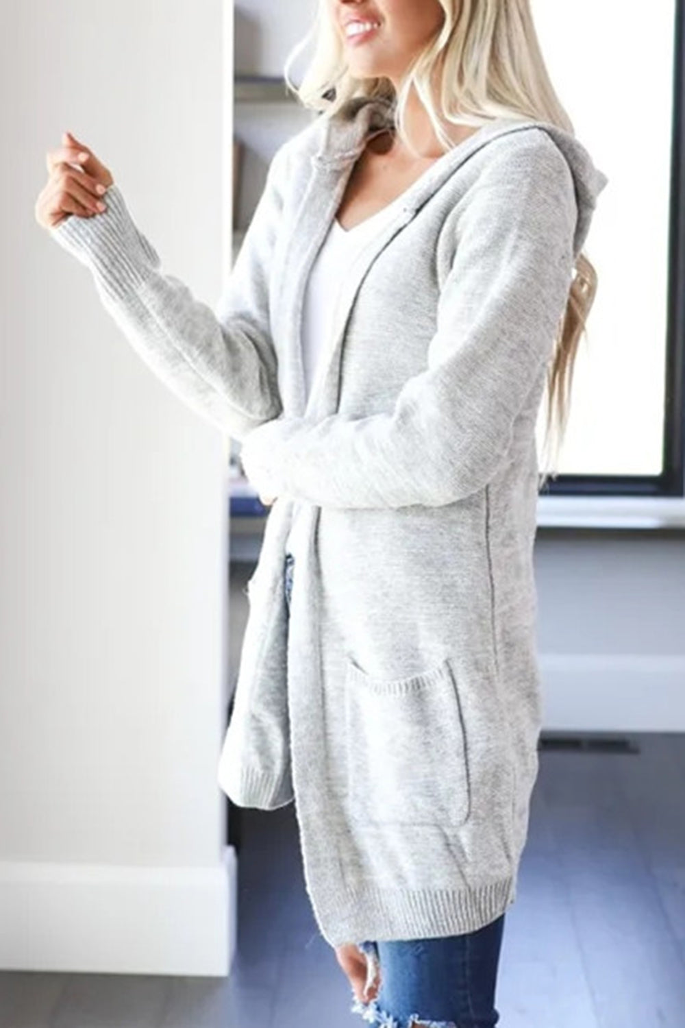 Light gray heathered knit open cardigan with hood and pockets.