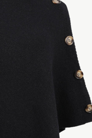Black acrylic knit poncho with button detail on the side.