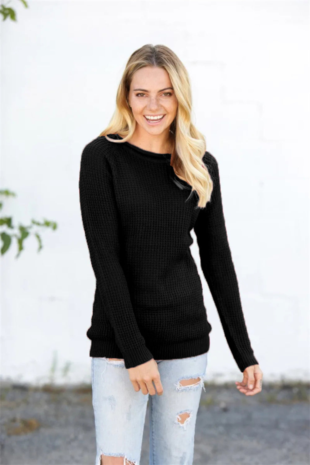 Black acrylic knit pullover sweater with honeycomb texture and crew neck.