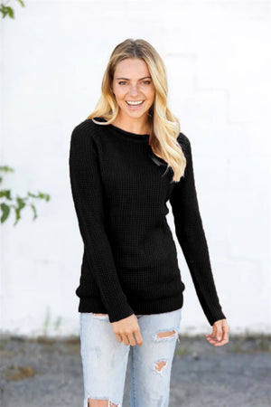 Black acrylic knit pullover sweater with honeycomb texture and crew neck.