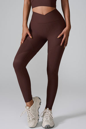 Brown ribbed contour leggings with V-waist and seam details.
