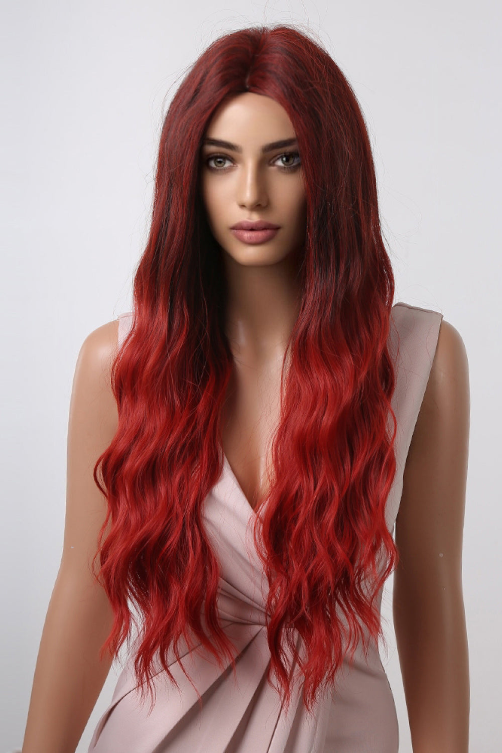 Crimson ombre synthetic wave wig with dark roots and bright red ends.