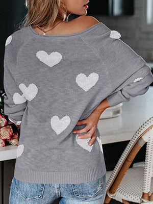Gray raglan knit sweater with white heart pattern, crew neck, acrylic blend.