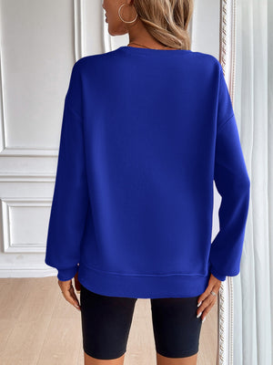 Relaxed fit royal blue crewneck sweatshirt with long sleeves and ribbed cuffs and hem.