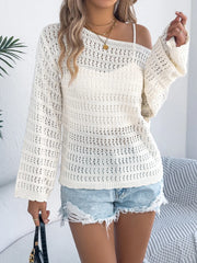 Ivory openwork knit sweater with bell sleeves and boatneck, styled with denim shorts.