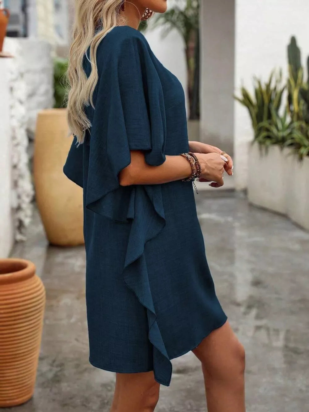 Dark navy ruffled sleeve V-neck mini dress with a casual flowy fit.