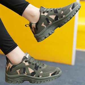 Camouflage mesh performance trainers in moss green with lace-up closure and athletic sole.