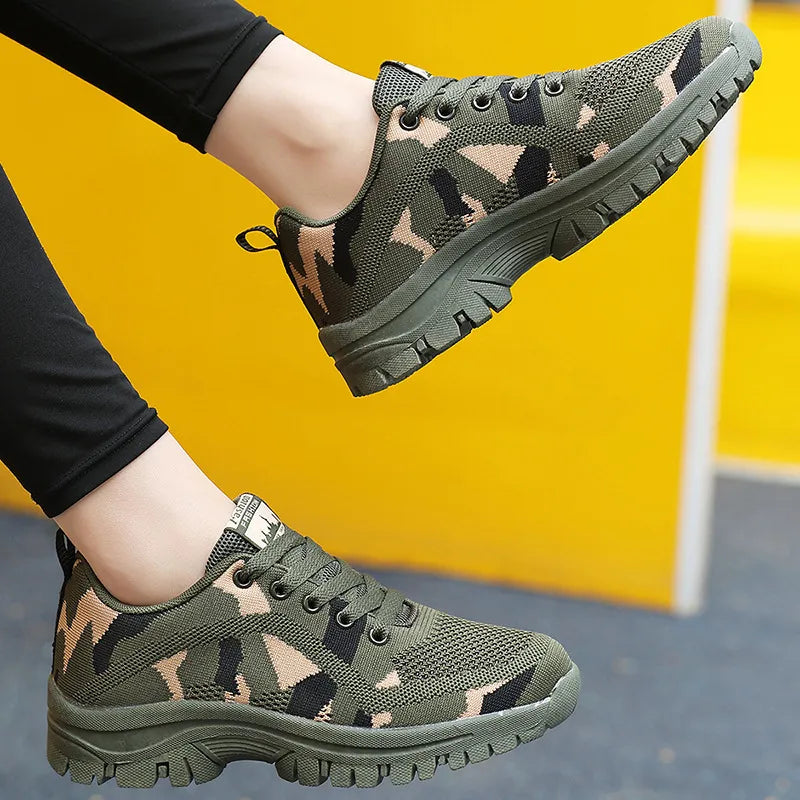 Camouflage mesh performance trainers in moss green with lace-up closure and athletic sole.
