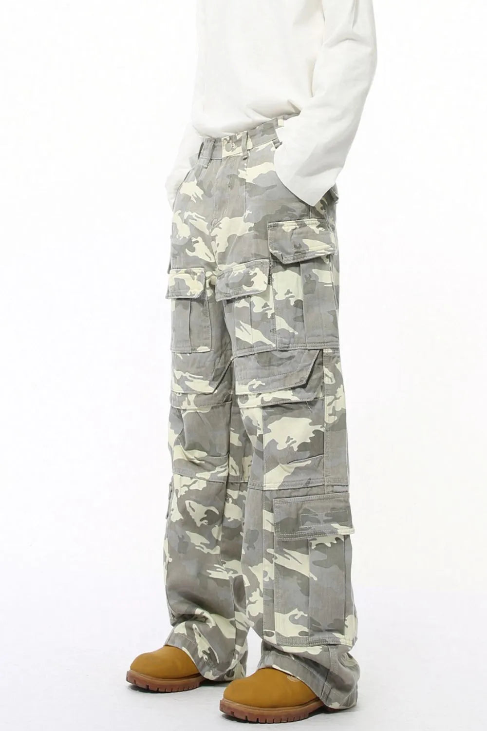 Oversized camo utility cargo pants in gray with multiple pockets.