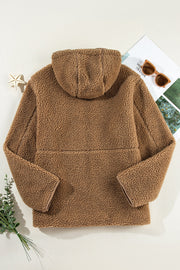 Brown sherpa hooded jacket with contrast trim and fleece lining.